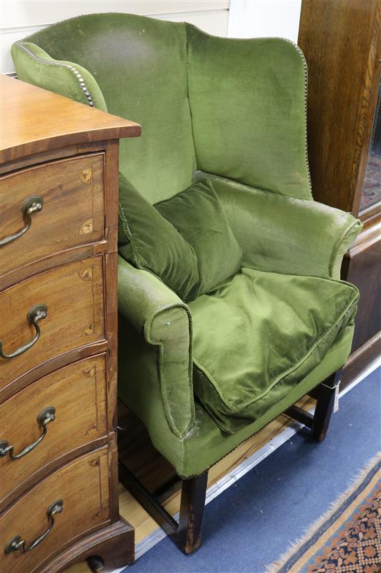 A Georgian style mahogany wing armchair
